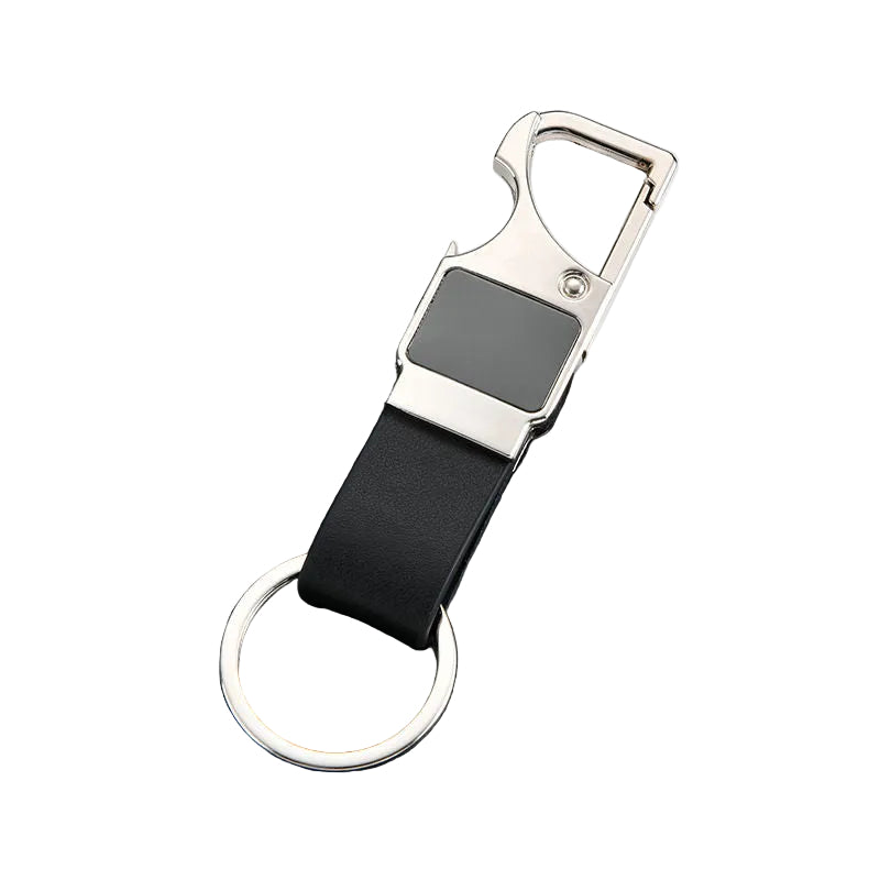 Keychain with black strap and silver clip on a dark textured surface