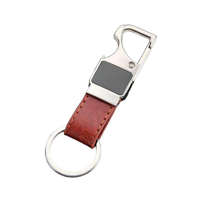 Keychain with black strap and silver clip on a dark textured surface
